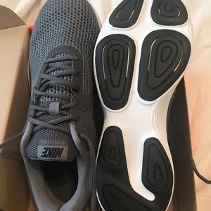 Grey and black Nike Revolution